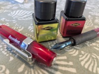 Bottles of ink and a fountain and dip pen
